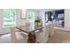 Dining room boasts a wooden table and bright windows, perfect for hosting gatherings at 4095 N Broadland Nw Rd, Atlanta, GA 30342