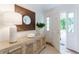 Tastefully decorated foyer features a stylish console table, elegant mirror, and an inviting open doorway at 4095 N Broadland Nw Rd, Atlanta, GA 30342