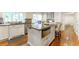 Bright kitchen with an island, stainless steel appliances, and hardwood floors at 4095 N Broadland Nw Rd, Atlanta, GA 30342