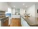Spacious kitchen with granite counters, stainless steel appliances and ample storage at 4095 N Broadland Nw Rd, Atlanta, GA 30342