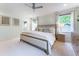 Spacious main bedroom with a ceiling fan, carpet, and natural light at 4095 N Broadland Nw Rd, Atlanta, GA 30342