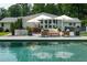 Stunning pool area with comfortable seating, umbrellas, and a lovely patio, creating an ideal space for outdoor enjoyment at 4095 N Broadland Nw Rd, Atlanta, GA 30342