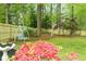 Fenced backyard offers a swing and established greenery for enjoyable outdoor living at 909 Ne Otter Way Ne Way, Marietta, GA 30068