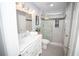 Bathroom featuring a vanity with marble countertop and glass shower with gray tiled floors at 909 Ne Otter Way Ne Way, Marietta, GA 30068