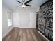 Bedroom with luxury vinyl plank flooring and motivational wall art adding character at 909 Ne Otter Way Ne Way, Marietta, GA 30068