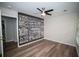 Bedroom with luxury vinyl plank flooring, a ceiling fan, and statement wall decor at 909 Ne Otter Way Ne Way, Marietta, GA 30068