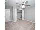 Carpeted bedroom with a ceiling fan and a closet at 909 Ne Otter Way Ne Way, Marietta, GA 30068