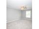 Upstairs bonus room featuring plush carpet and neutral paint at 909 Ne Otter Way Ne Way, Marietta, GA 30068