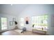 Bright bonus room with vaulted ceilings, large windows, and vinyl plank flooring at 909 Ne Otter Way Ne Way, Marietta, GA 30068