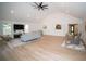 Open-concept living room with hardwood floors, lots of natural light, and modern furnishings at 909 Ne Otter Way Ne Way, Marietta, GA 30068