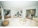 Living room featuring fireplace and views into dining room and foyer at 909 Ne Otter Way Ne Way, Marietta, GA 30068