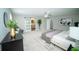 Spacious main bedroom featuring sliding barn door to en-suite bathroom and ample natural light at 909 Ne Otter Way Ne Way, Marietta, GA 30068