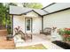Charming patio with comfortable wicker furniture, decorative plants, and an outdoor rug at 909 Ne Otter Way Ne Way, Marietta, GA 30068