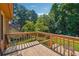 Spacious wooden back deck, perfect for outdoor seating and enjoying the lush, green backyard at 1159 Midland Nw Dr, Acworth, GA 30102