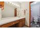 Bathroom with large vanity and sink, open doorway to the toilet and shower at 1159 Midland Nw Dr, Acworth, GA 30102