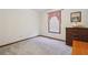 Small bedroom features a carpet, wooden furniture, and a mirror at 1159 Midland Nw Dr, Acworth, GA 30102