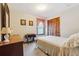 Cozy bedroom with neutral carpet, curtains, and built-in closet at 1159 Midland Nw Dr, Acworth, GA 30102