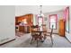 Cozy dining area with wooden furniture, complemented by kitchen access and natural light at 1159 Midland Nw Dr, Acworth, GA 30102