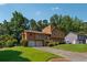 Suburban home featuring an attached two-car garage and a lush green lawn at 1159 Midland Nw Dr, Acworth, GA 30102