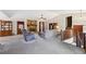 Spacious living room featuring a stone fireplace, plush carpeting, and neutral paint at 1159 Midland Nw Dr, Acworth, GA 30102