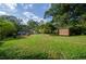 Expansive backyard with shed and lush green grass at 123 Arnold Pl, Jonesboro, GA 30236