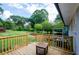 Back deck overlooking a lush backyard with mature trees at 123 Arnold Pl, Jonesboro, GA 30236