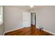 Bedroom with hardwood floors, closet, and access to hall at 123 Arnold Pl, Jonesboro, GA 30236