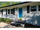 Covered front porch with dark trim details and modern paint at 123 Arnold Pl, Jonesboro, GA 30236