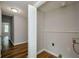 Functional laundry room with neutral walls and wood-look flooring at 123 Arnold Pl, Jonesboro, GA 30236