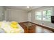 Bright living room with hardwood floors, neutral walls and a sun-filled window at 123 Arnold Pl, Jonesboro, GA 30236