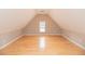 Finished attic space with hardwood floors and a dormer window for natural light at 2427 Camata, Marietta, GA 30066