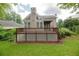Well-maintained back exterior of home with a deck, large windows, and nice landscaping at 2427 Camata, Marietta, GA 30066