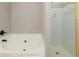 Bathroom showcases a soaking tub with black fixtures, and a separate shower stall at 2427 Camata, Marietta, GA 30066
