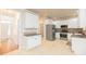 Bright kitchen featuring white cabinets, stainless steel appliances, and a light tile floor at 2427 Camata, Marietta, GA 30066