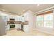 Eat-in kitchen with lots of natural light, white cabinets, and stainless steel appliances at 2427 Camata, Marietta, GA 30066