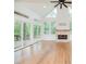 Bright living area with hardwood floors, a modern fireplace, and large glass doors to a deck at 2427 Camata, Marietta, GA 30066