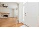 A spacious living room featuring hardwood floors and a white fireplace and a door to the outside at 2427 Camata, Marietta, GA 30066