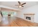 A bright, open-concept living space with hardwood floors and two fireplaces, creating a warm ambiance at 2427 Camata, Marietta, GA 30066