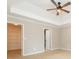 Main bedroom featuring a tray ceiling and neutral carpeting at 2427 Camata, Marietta, GA 30066