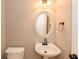 Powder room with a pedestal sink and decorative mirror at 2427 Camata, Marietta, GA 30066