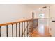 Upstairs landing area with hardwood floors and wrought iron railings at 2427 Camata, Marietta, GA 30066