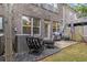Brick patio area with comfortable seating, a grill, and privacy fence, perfect for outdoor living at 3931 Fireoak Dr, Decatur, GA 30032