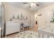 Well-organized Bedroom with a changing table, crib, ample storage, and a cheerful, -friendly design at 3931 Fireoak Dr, Decatur, GA 30032