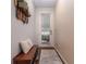 Inviting entryway with a wooden bench and storage, decorative wall art, and a rug at 3931 Fireoak Dr, Decatur, GA 30032