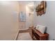 Hallway with hardwood floors, decorative wall art, and a wooden bench and shoe storage at 3931 Fireoak Dr, Decatur, GA 30032