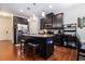 Stylish kitchen with dark cabinetry, stainless steel appliances, and a granite-topped island at 3931 Fireoak Dr, Decatur, GA 30032