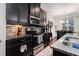 The kitchen showcases granite counters, stainless steel appliances, dark cabinetry, and seamlessly connects to the adjacent dining area at 3931 Fireoak Dr, Decatur, GA 30032