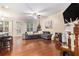 Spacious living room boasts hardwood floors, ample natural light, and a stylish decor with comfortable seating and backyard access at 3931 Fireoak Dr, Decatur, GA 30032