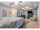 Comfortable bedroom with a king bed, dresser, accent chair, and natural light at 3931 Fireoak Dr, Decatur, GA 30032