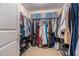 Organized walk-in closet with shelving, hanging racks and ample storage for clothing and accessories at 3931 Fireoak Dr, Decatur, GA 30032